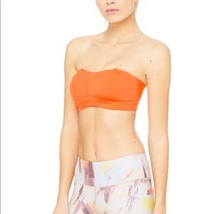 Alo yoga sports bra in a vibrant orange!